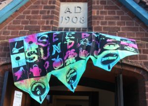 The Seedy Sunday banner at the entrance to the Village Hall